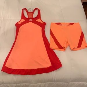 Adidas orange/ref tennis dress with matching under shorts. Size Med/UK 9-10.